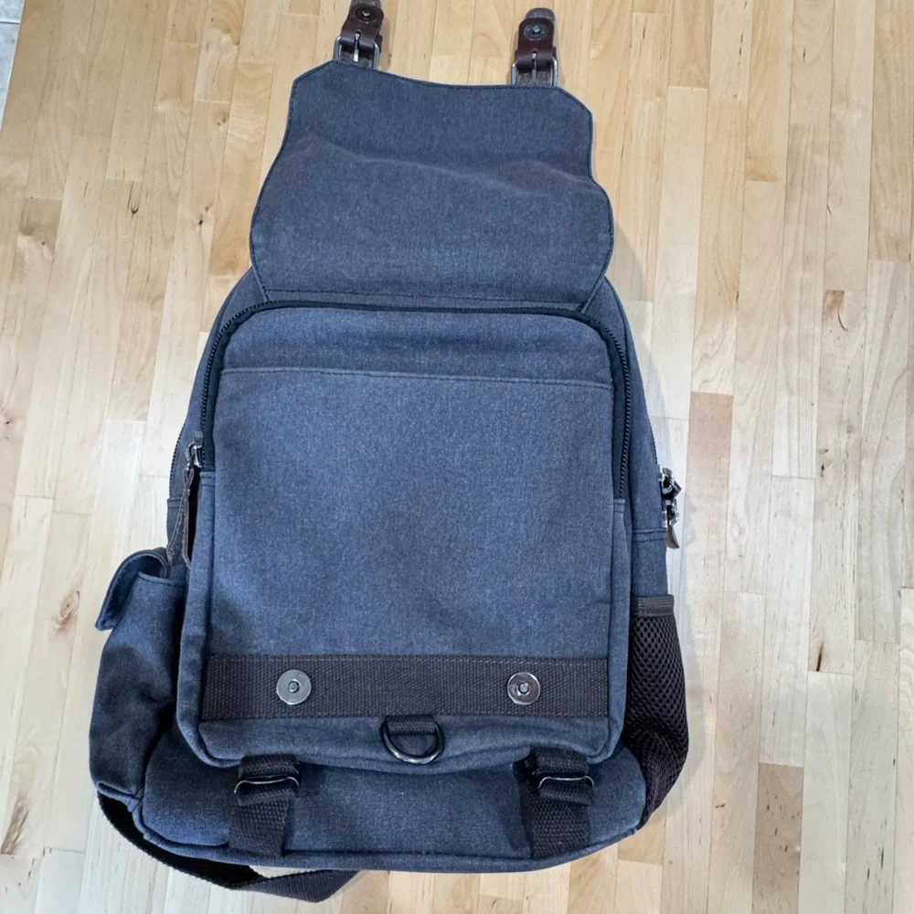 Gray Canvas Crossbody Backpack with Brown Accents Multiple Compartments Durable